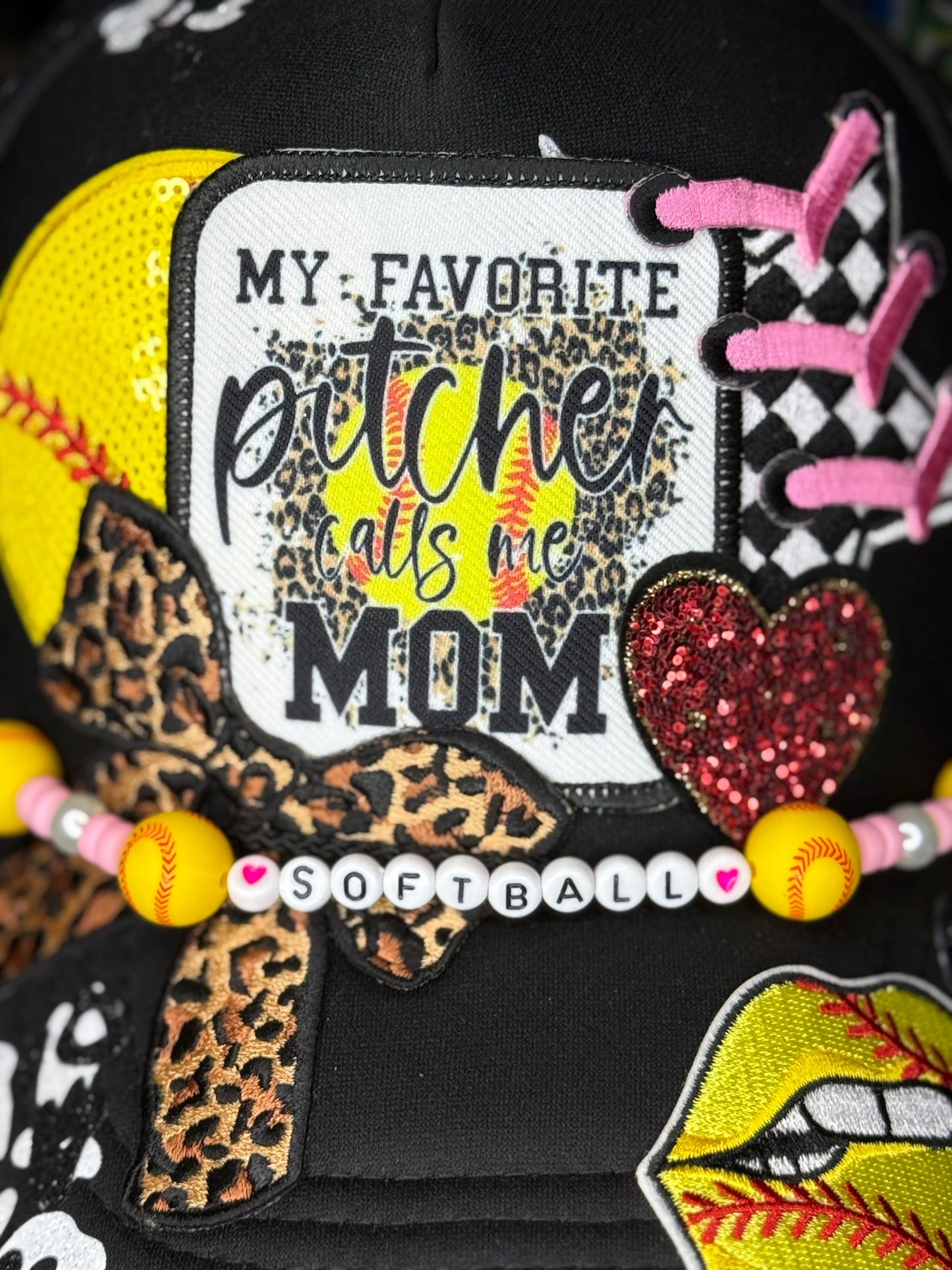 Cheer for your favorite player in style with this glittery “My Favorite Pitcher Calls Me Mom” softball hat! Perfect gift for softball moms and sports lovers.