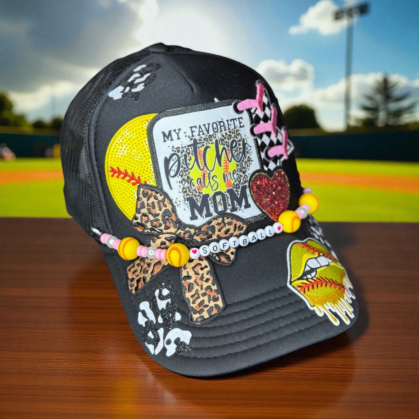 Cheer for your favorite player in style with this glittery “My Favorite Pitcher Calls Me Mom” softball hat! Perfect gift for softball moms and sports lovers.