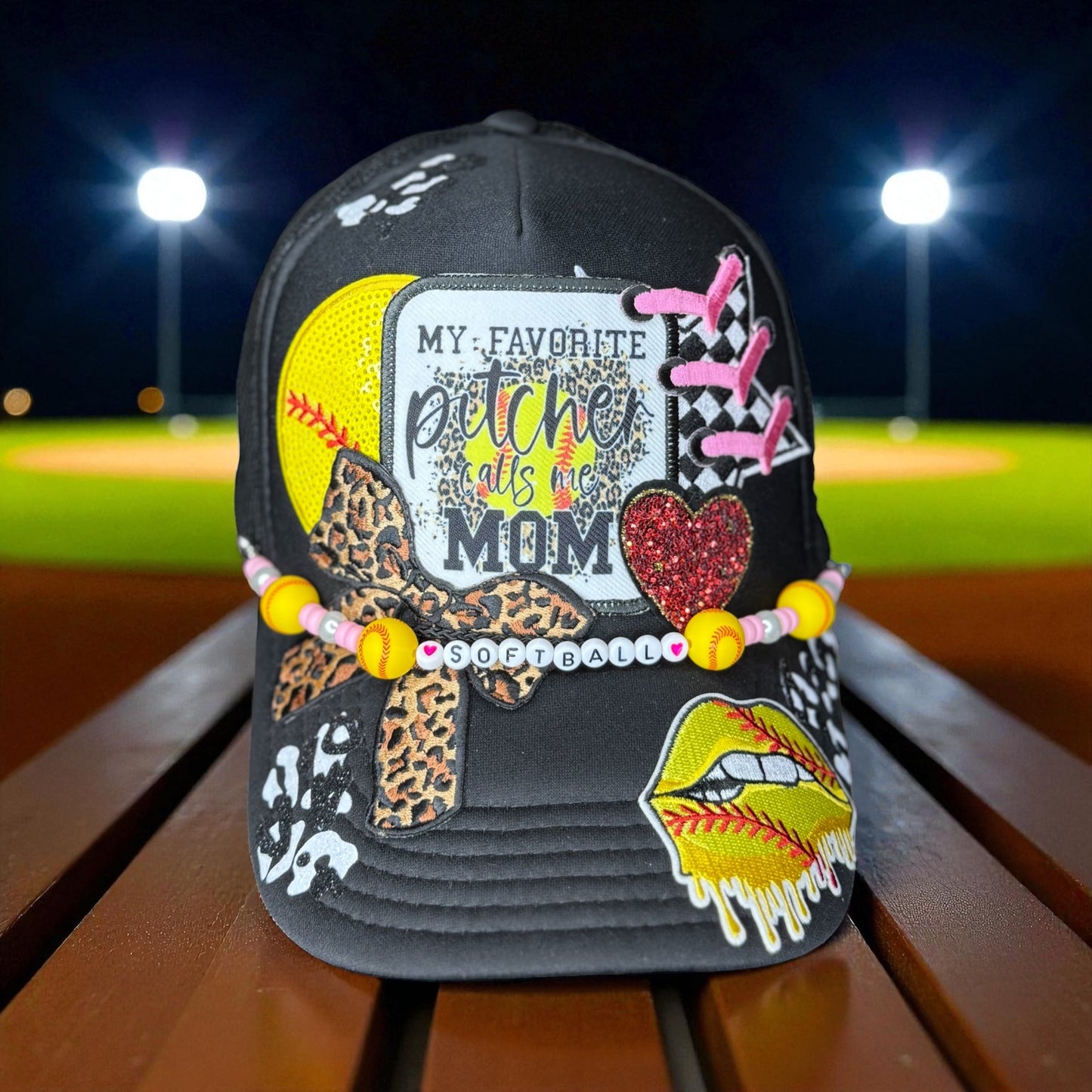 Cheer for your favorite player in style with this glittery “My Favorite Pitcher Calls Me Mom” softball hat! Perfect gift for softball moms and sports lovers.