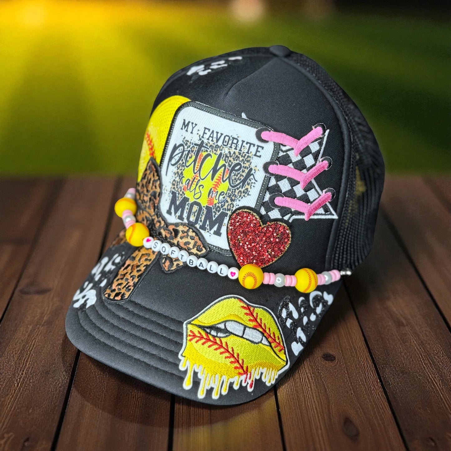 Cheer for your favorite player in style with this glittery “My Favorite Pitcher Calls Me Mom” softball hat! Perfect gift for softball moms and sports lovers.